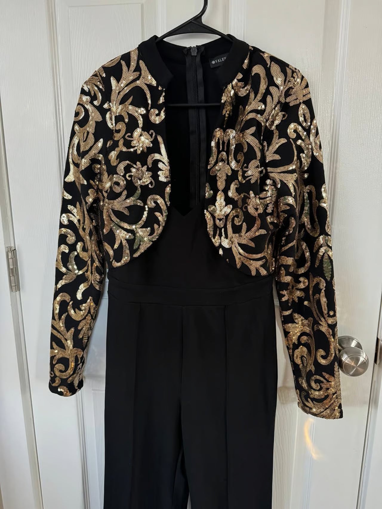 The Girl in the Black and Gold Jumpsuit