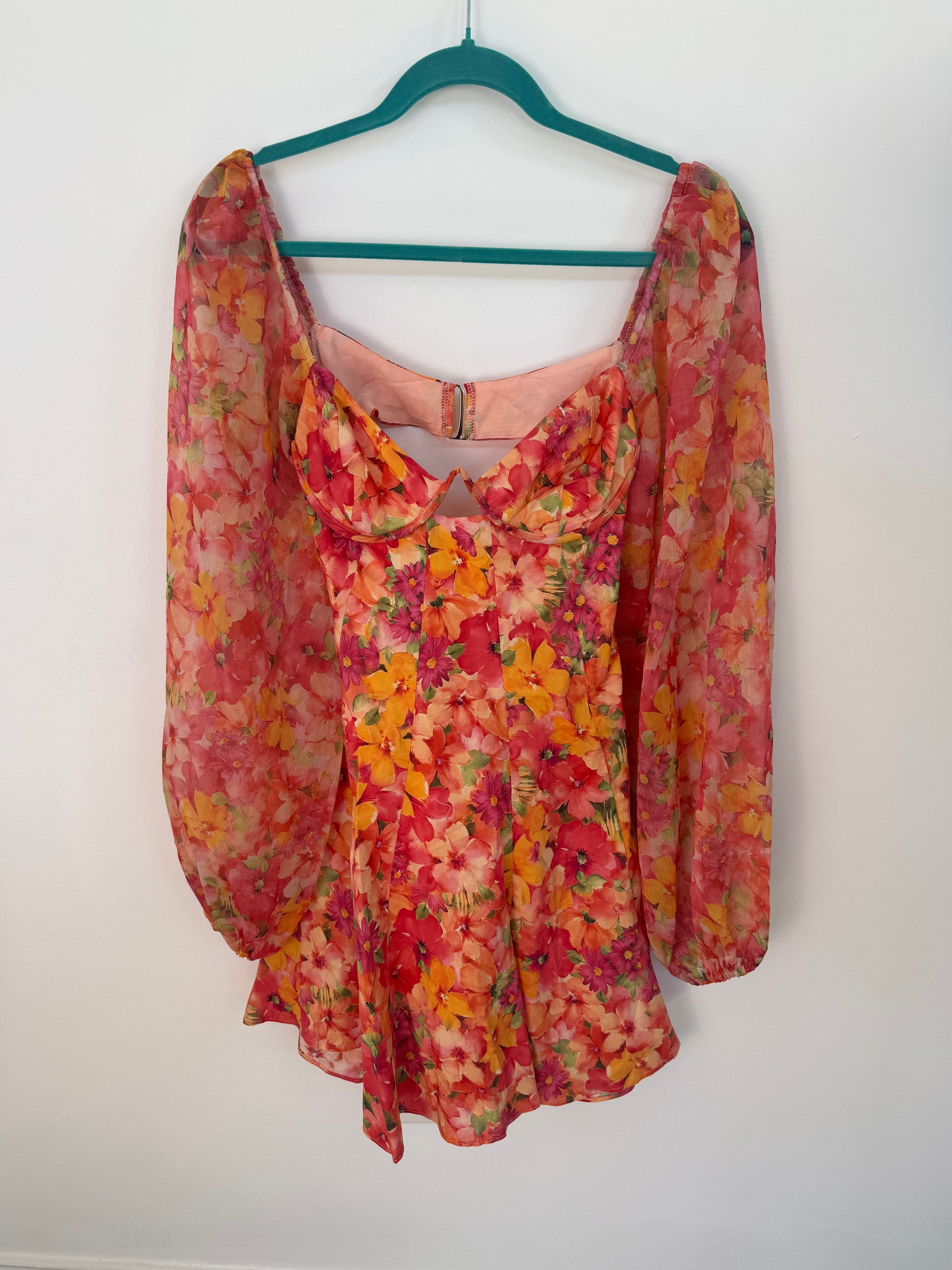 Front view of dress on hanger.
