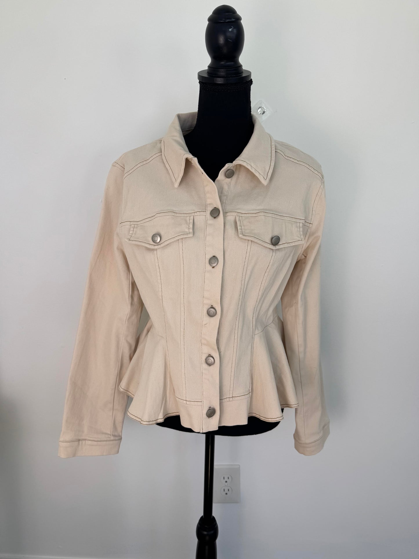 Beige denim jacket with 7 gray buttons that button to the lapel neck. Faux pocket design on both sides with 1 grary button on each pocket. Straight Sleeve. Peplum hem.